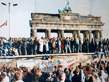 west and east germans at the brandenburg gate in